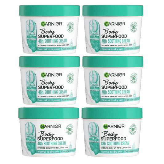Six containers of Garnier Body Superfood 48-hour soothing cream on a white background
