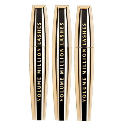 Three bottles of 'Volume Million Lashes' mascara on a white background