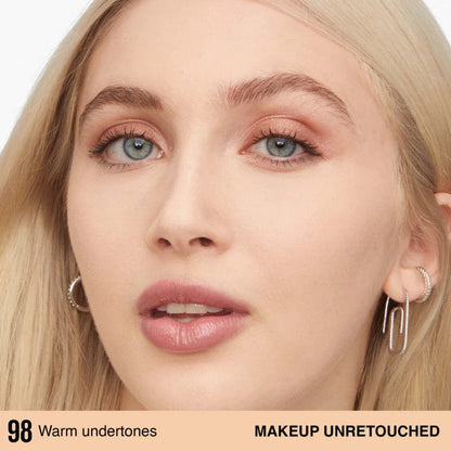 Close-up of a person with blonde hair and earrings, with text indicating warm undertones and unretouched makeup.